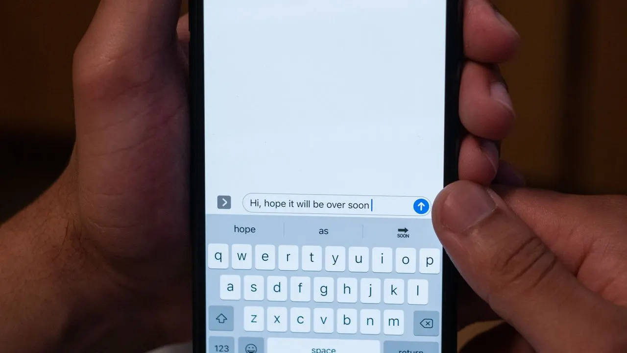 Close-up of a phone with a text message being typed